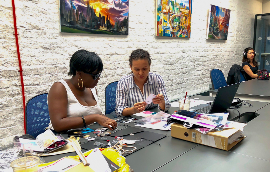 A photo of two of The Studio Workspace members working together