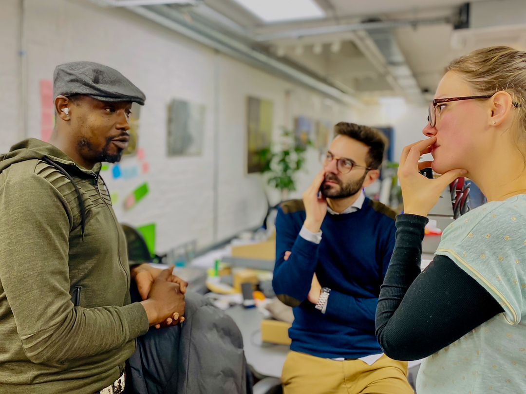 Three of The Studio Workspace members having a conversation